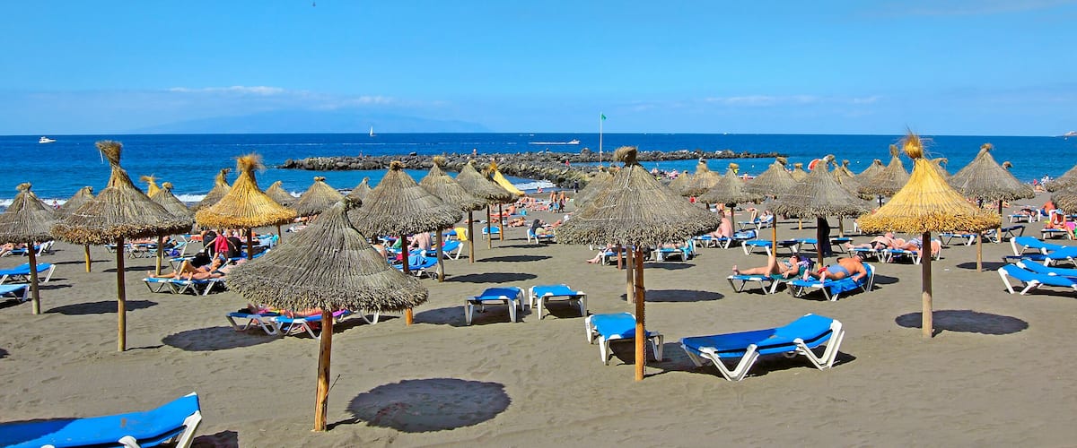 Beach in the tourist resort Playa de las Americas, Tenerife island, Canary Islands, Spain