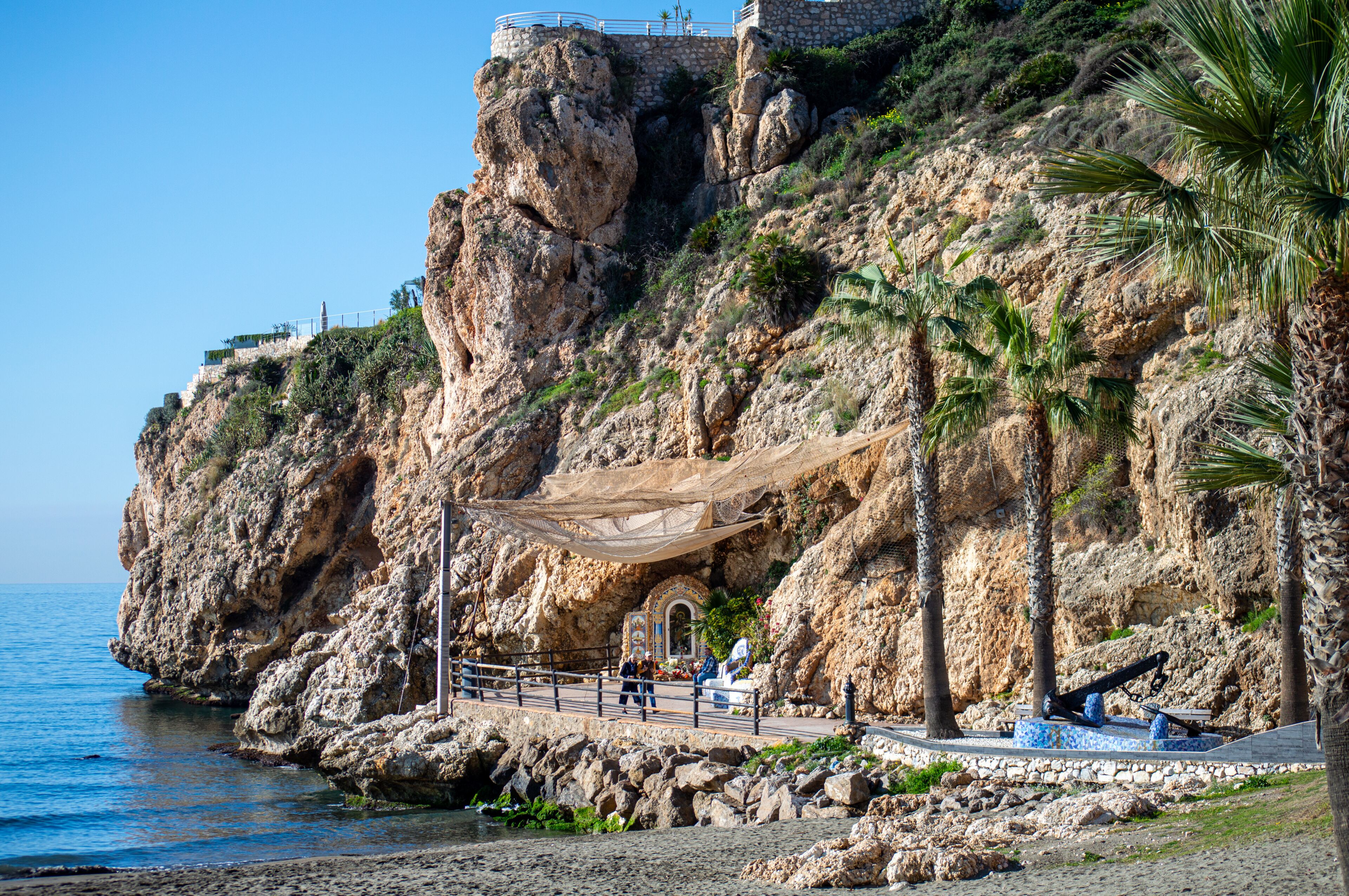 Morning walking on paths above rocks and through "El Cantal" tunnels in Rincon de la Victoria, Spain