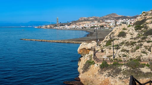 Morning walking on paths above rocks and through "El Cantal" tunnels in Rincon de la Victoria, Spain