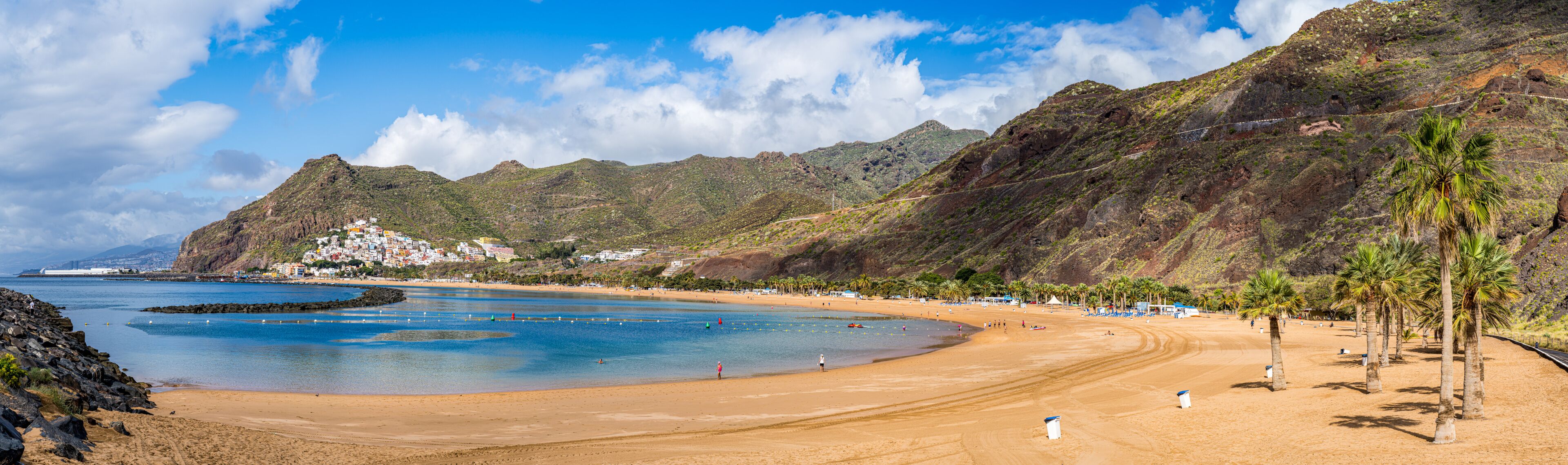 Las Teresitas Beach with its golden Sahara sands, nestled by Tenerife lush Anaga Mountains, and the charming San Andres village.