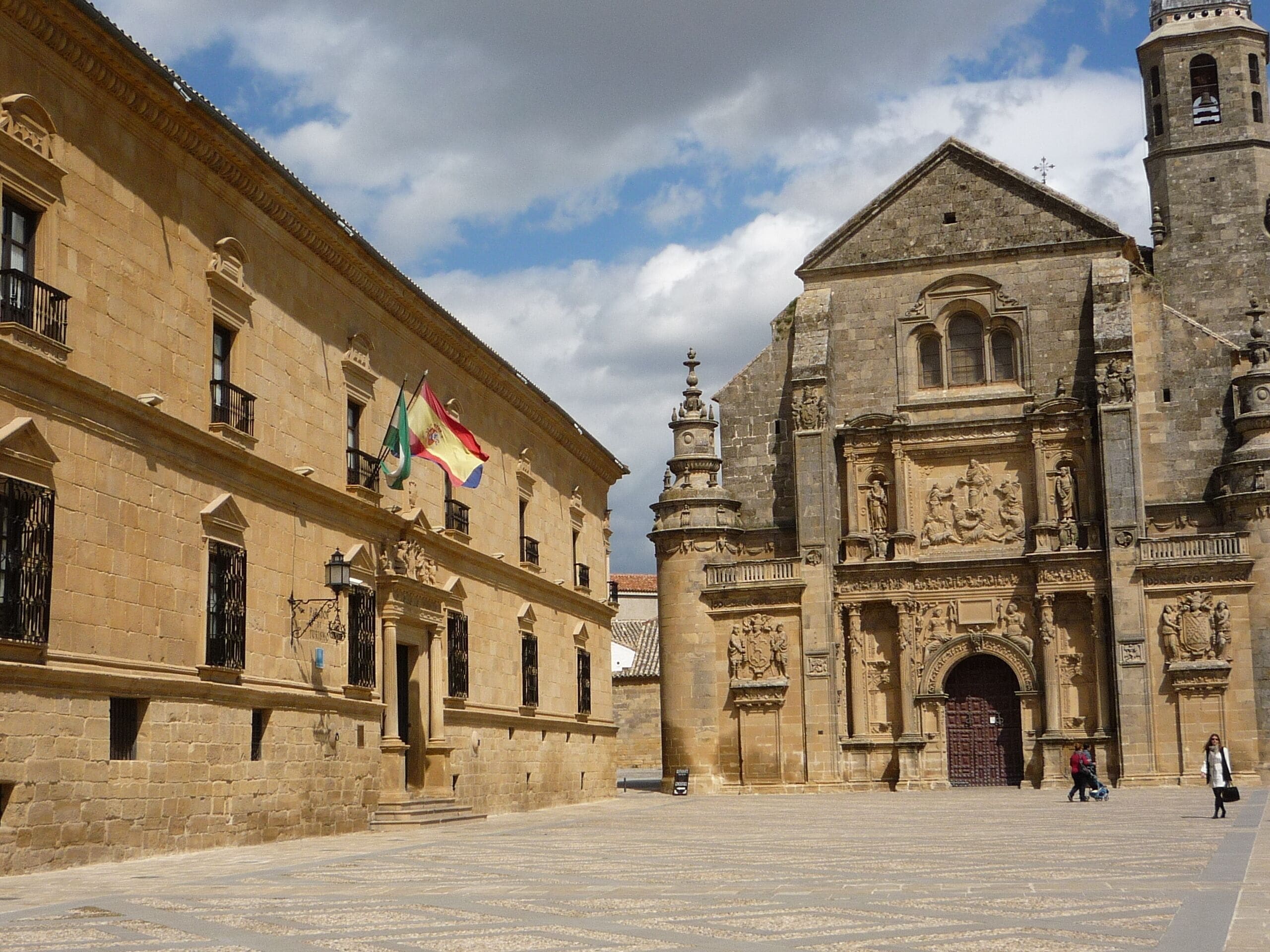 A historic building with intricate carvings and a large arched entrance.