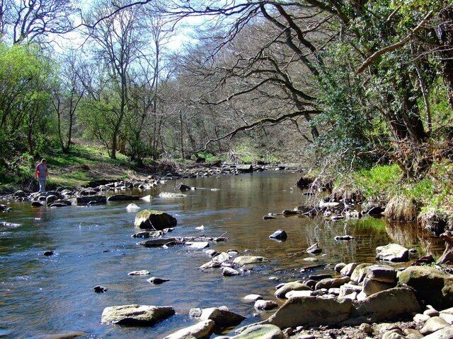 River Derwent Spring morning with rocks giving a lead into the focal point, with muted reflections giving a sense of tranquility.