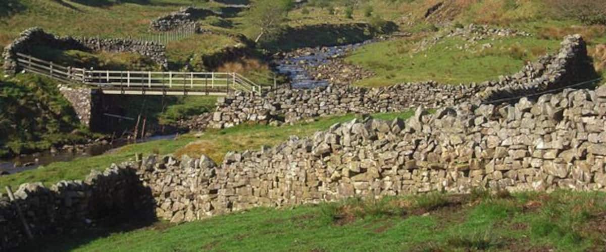 Gilderdale With the Pennine Way footbridge crossing the burn.