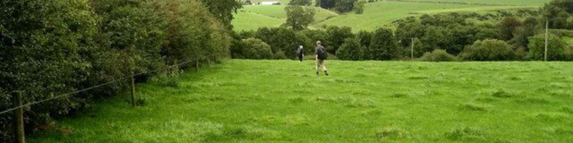Footpath south of Brampton Beck The footpath is not visible on the ground, but is marked on the Ordnance Survey Map. It follows the hedge, dropping down to cross Brampton Beck before heading north towards Dufton.
