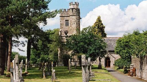 West tower and south porch of St Peter's parish church, Dalwood, Devon, seen from the south