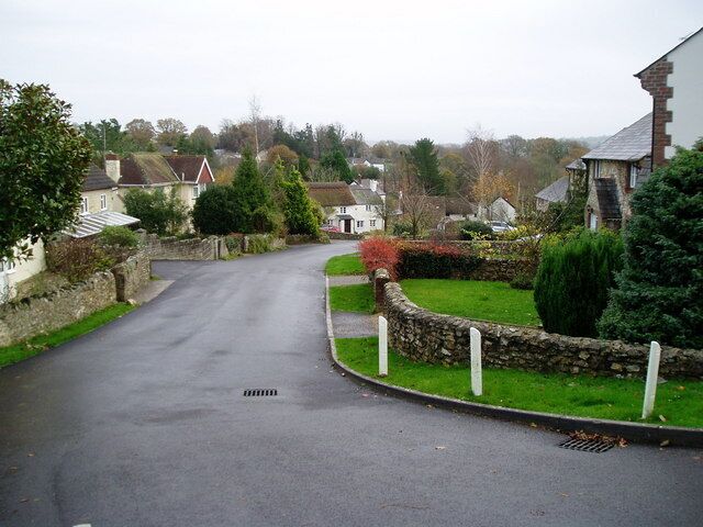 Front gardens in Smallridge Road to Smallridge Village Hall and Church.