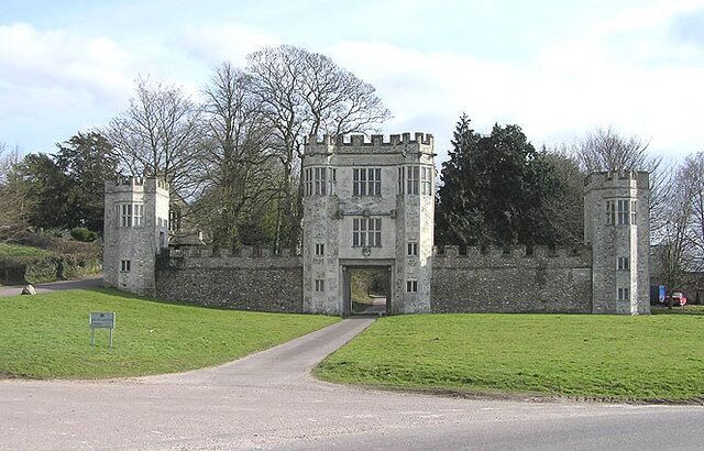 Entrance to Shute Barton. Parish church can just be seen behind the left end turret