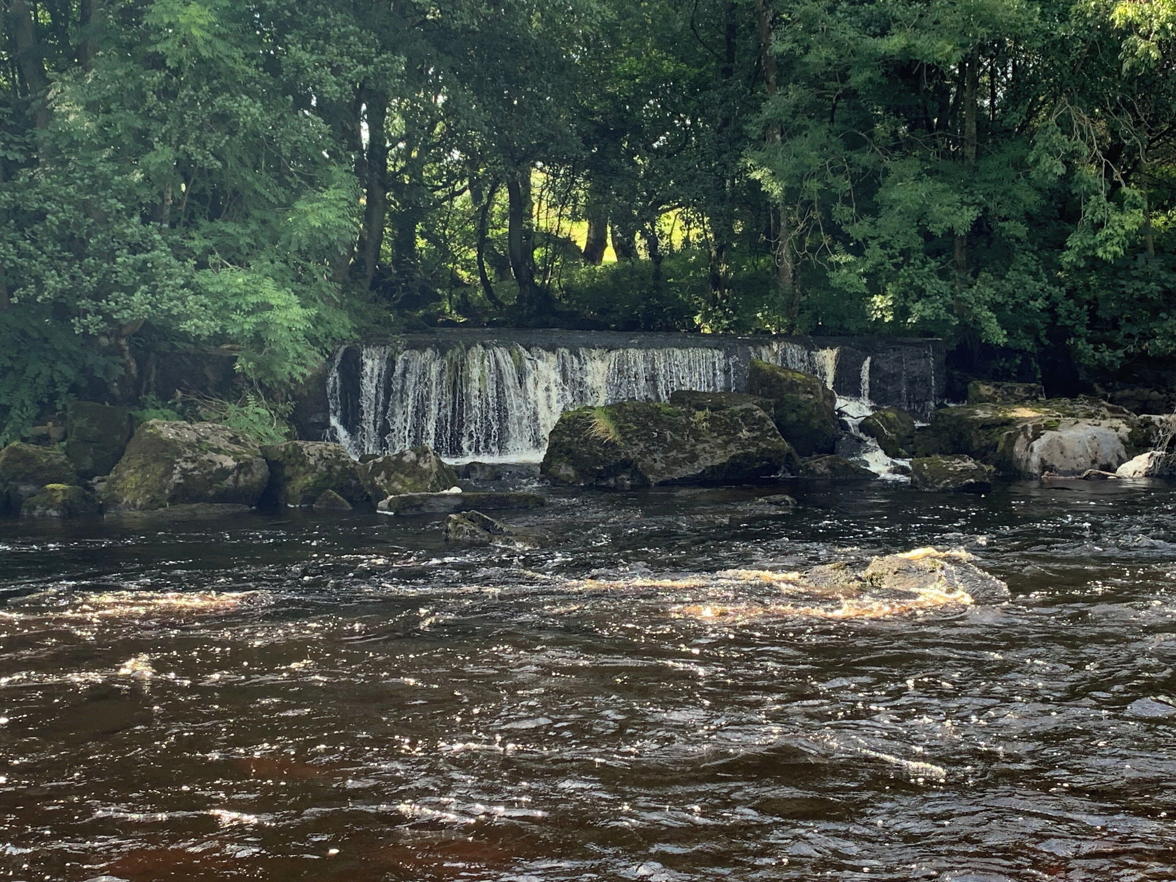 Waterfall running into the river