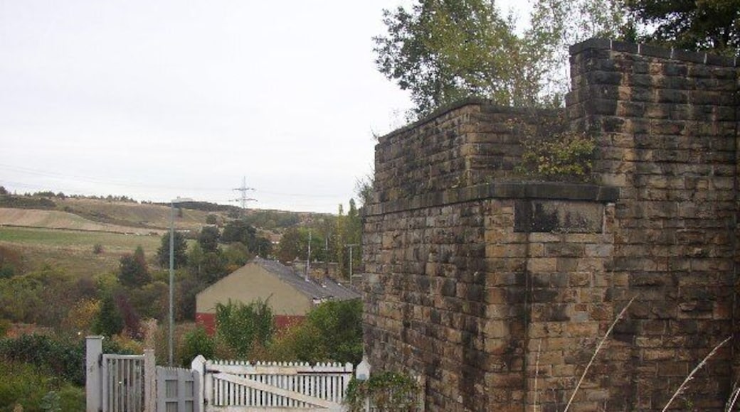 Lady Ann Level Crossing, Batley. This is at the top of Primrose Hill, looking east from Stoney Lane. The railway is the main line from Dewsbury to Leeds, and the bridge abutment was for the Batley and Adwalton Line. The bridge was over the level crossing.
