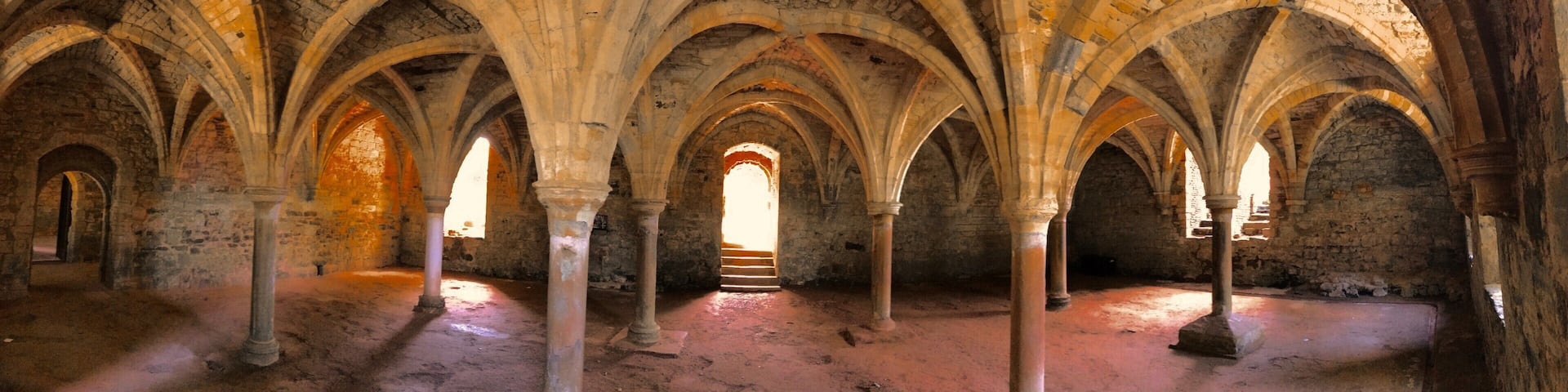 Visiting the Site of the Battle of Hastings that took place in 1066, The crypt of the church is built over the site where Harold II was defeated. (allegedly shot in the eye with an arrow) This led to the beginning of the Norman conquest of England and its history. Under the remains of the church are the amazing vaunted rooms of the dormitory in the east wing.
http://www.english-heritage.org.uk/visit/places/1066-battle-of-hastings-abbey-and-battlefield/history-and-stories/description/