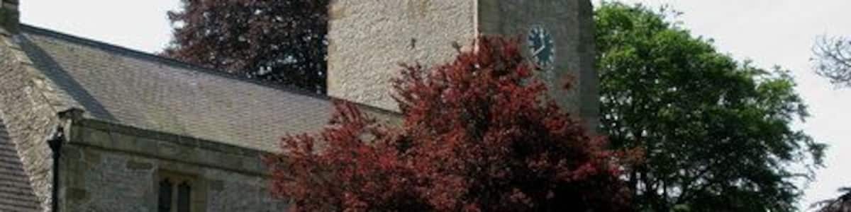 Kirklington War Memorial In St Michael's Churchyard at Kirklington.