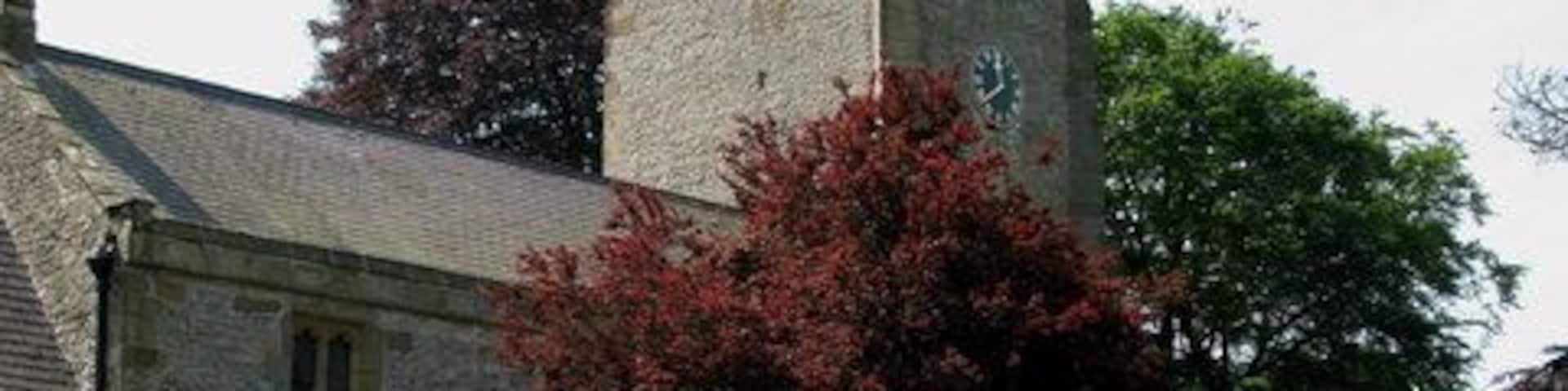 Kirklington War Memorial In St Michael's Churchyard at Kirklington.