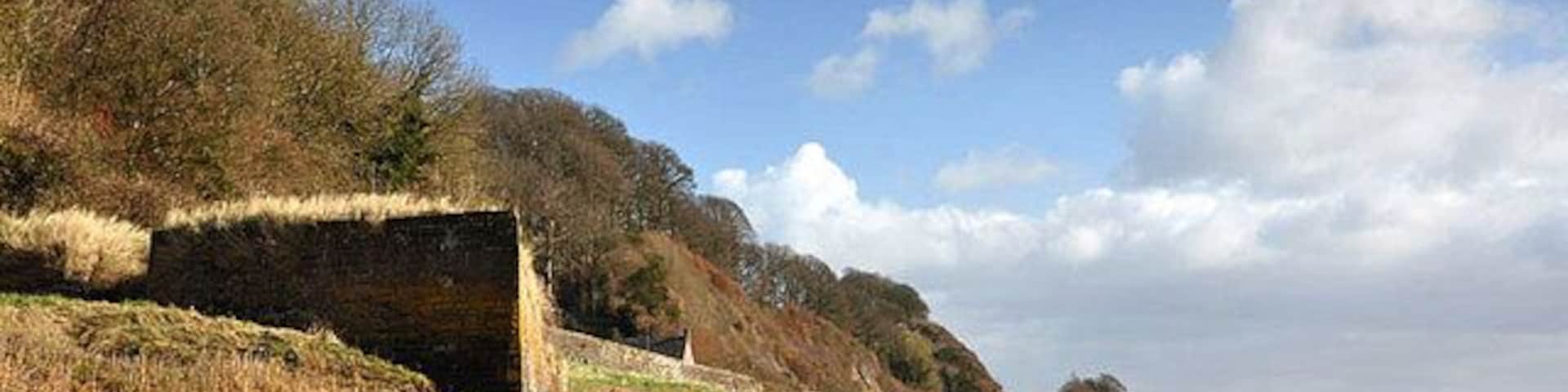 Severn Foreshore The brick structure I presume used to be a dock, the wall protects the railway from Gloucester to Chepstow.