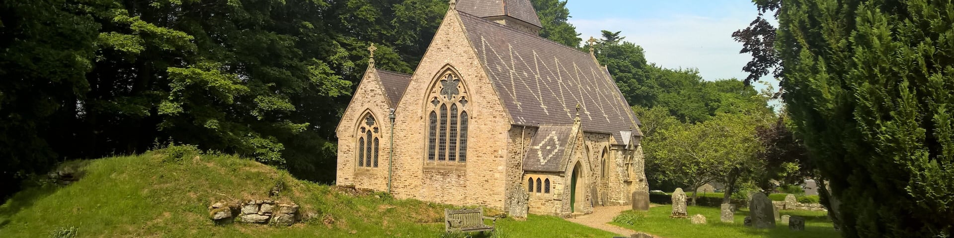 Parish church viewed from the west: 1862-3 rebuilding, by S.S. Teulon for Rev. Daniel Capper of Newbiggin, of 1781 church on medieval site. The ruins of a 16th-century pele tower are in the foreground.