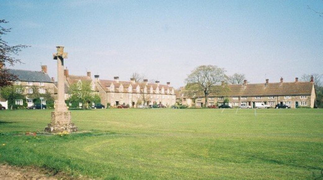Evenley, Northamptonshire: village green, war memorial and surrounding houses.