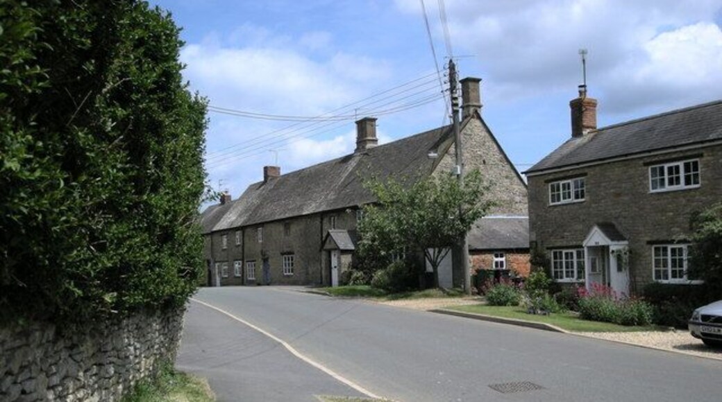 Cottages in Wappenham Road, Helmdon, Northamptonshire. Nos 22 and 24 (just beyond the telephone pole) are 18th-century and Grade II listed.