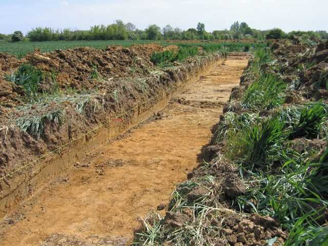 Archaeological dig, Rectory Farm, Brampton, Cambs One of several trial trenches along the new offline A14 route between Ellington and Fen Drayton. A thin, fine-textured solifluction deposit dating from the Late Devensian overlies Devensian gravels.