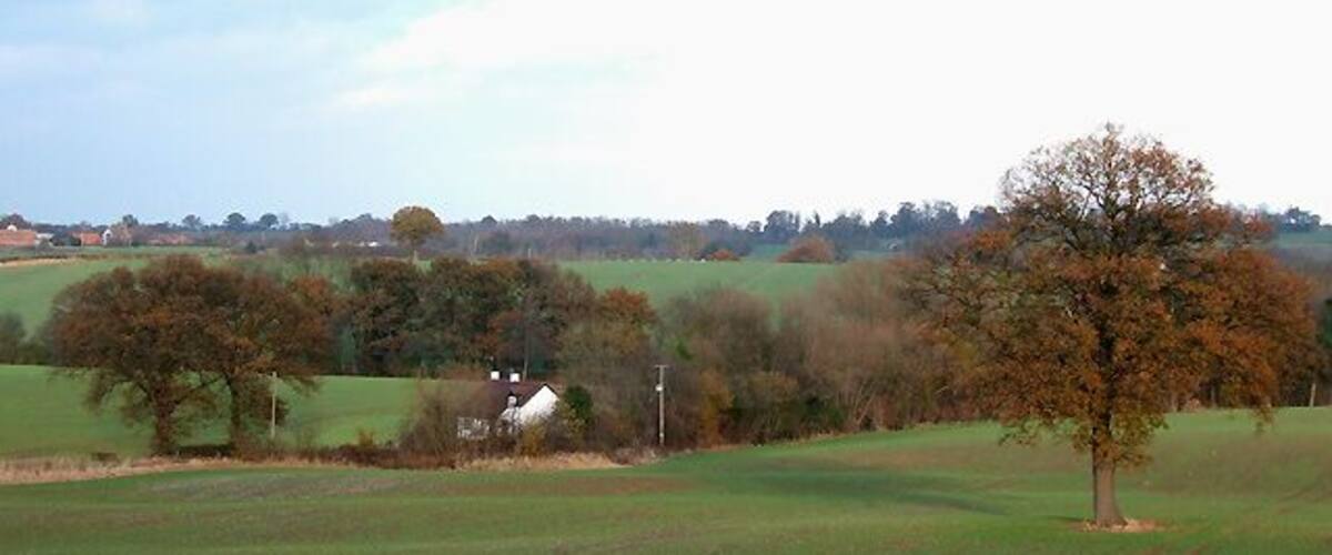 Shropshire Cropfields near Deuxhill Mellow afternoon sun accentuates the autumnal colours. Engineer Cottage is in the middle of the picture, and the buildings of Eudon Burnell on the skyline to the left.