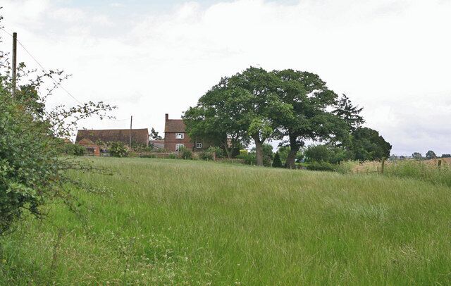 Tip House, seen from the end of the drive. A small and pretty Georgian farmhouse nestling in the Shropshire countryside.