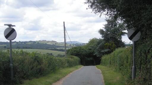 Lane to the ford The distinctive outline of Titterstone Clee Hill can be seen in the distance.