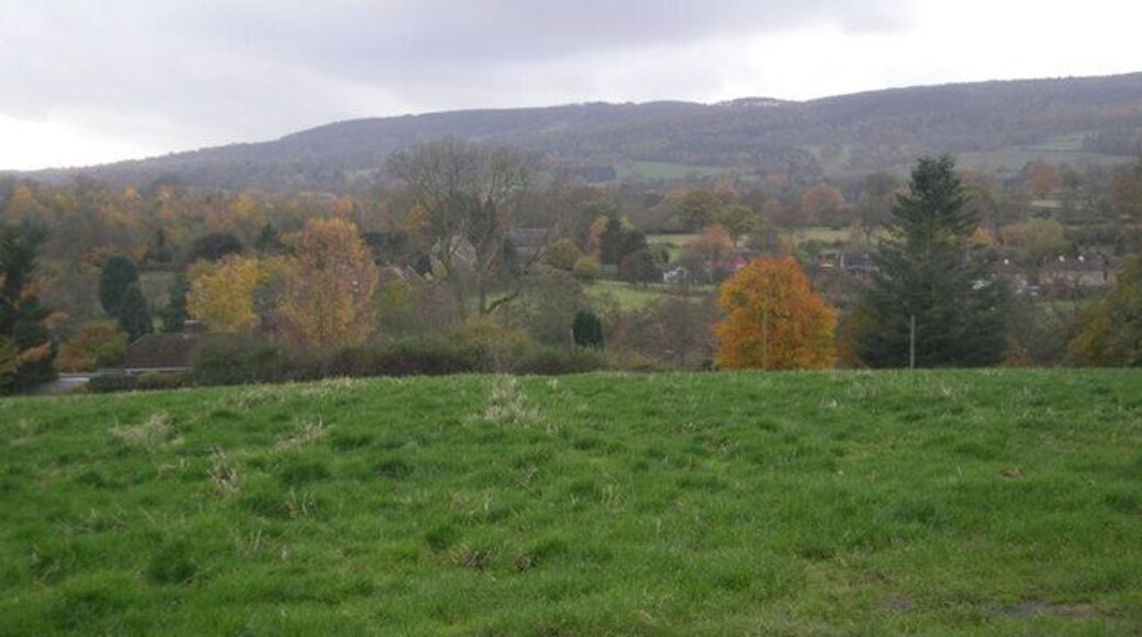 Grassy field in front of Neenton Brown Clee looms behind the village.