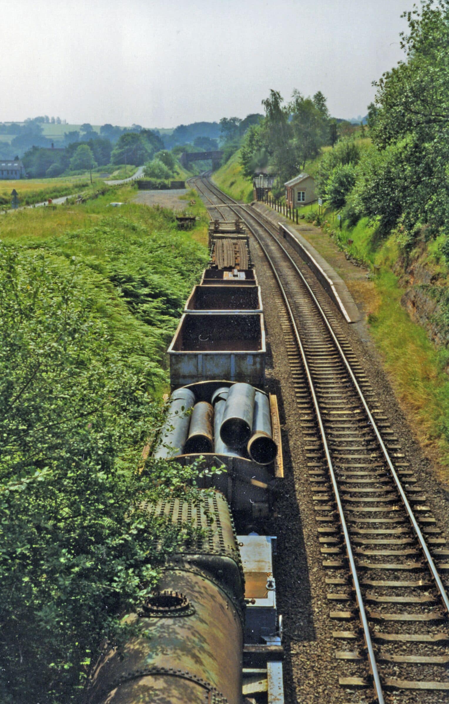 Eardington Halt, Severn Valley Railway 1997. View southward, towards Bewdley: ex-GWR Hartlebury - Bewdley - Bridgnorth - Shrewsbury line, now the celebrated heritage Severn Valley Railway, Kidderminster - Bewdley - Bridgnorth. Eardington Halt was closed with the whole line on 9/9/63. On acquisition of the line in 1970 the SVR used the Halt - but only until 1983, although the siding was kept in use for storing some of their collection of goods vehicles, as seen here. More recently, Eardington Halt has become a stopping-place for some Specials running on the SVR.