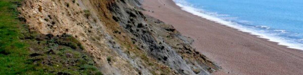 East Ebb from Seatown. This is the view from the low rising cliff top just east of the Winniford river mouth at Seatown looking towards the off shore roacks of east Ebb just below Doghouse Hill