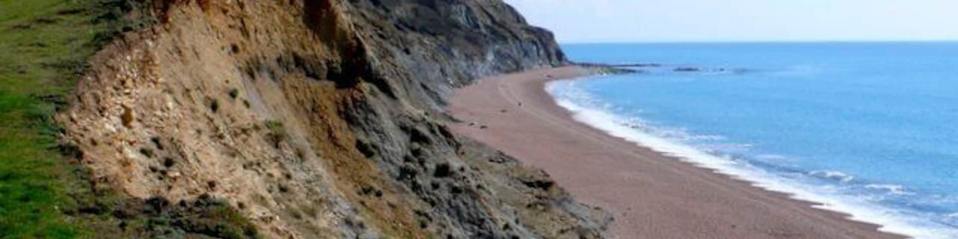 East Ebb from Seatown. This is the view from the low rising cliff top just east of the Winniford river mouth at Seatown looking towards the off shore roacks of east Ebb just below Doghouse Hill