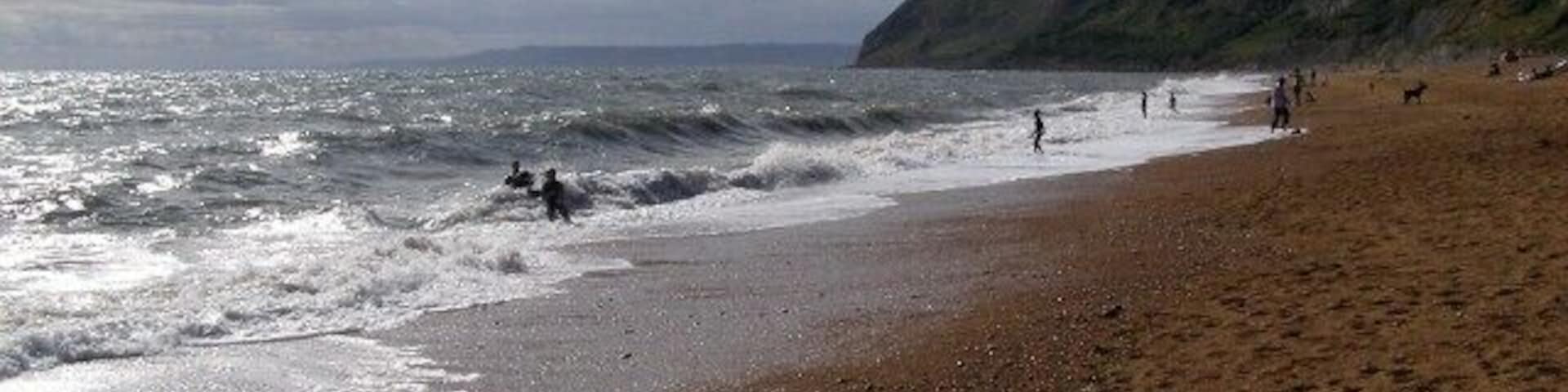 Beach at Eype's Mouth Looking west along the shingle beach at Eype's Mouth, with Thorncombe Beacon in the middle distance. In the far distance, across the bay, is the start of the Devon coast, around Lyme Regis.