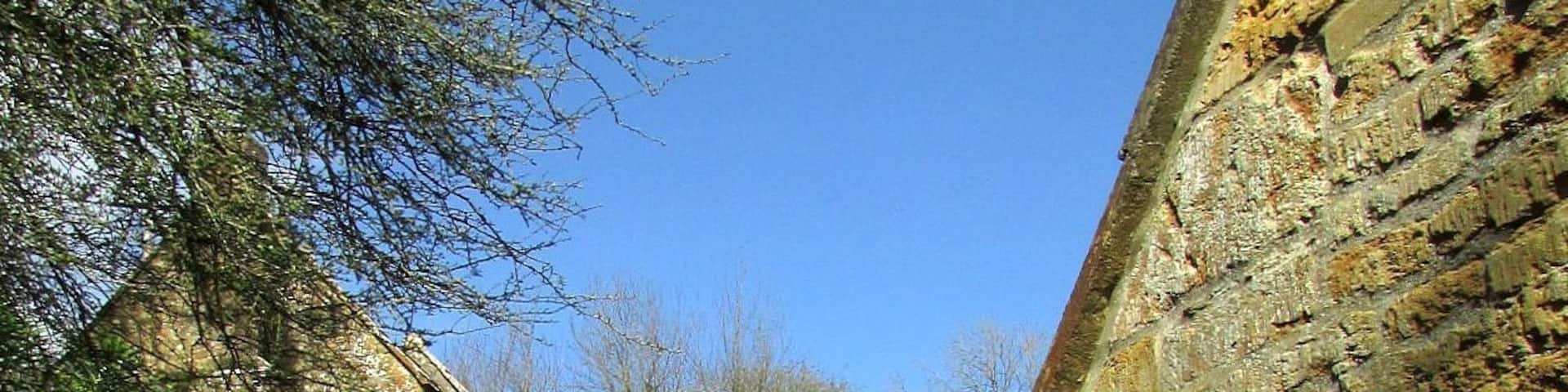 Cottage and cider house, Mappercombe. The C17 (dated 1698) cottage is grade II* listed, as is the cider house, whose west wall is on the immediate right. Footpath W39 70 climbs between them.