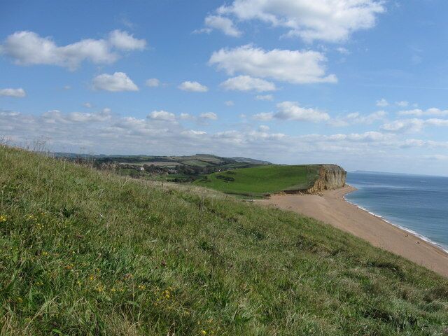 View from the coast path near Burton Freshwater, Dorset By getting close to the ground, I managed to hide the ugly caravan site nestling in the dip. The village of Burton Bradstock is just visible left of centre.