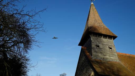 A Ryanair Boeing 737 passenger aircraft in descent to London Stansted Airport over the south west of St Mary the Virgin's Church, Broxted, Essex, England. Software: JPEG file optimized and/or cropped and/or spun with DxO OpticsPro 10 Elite and Adobe Photoshop CS2.
