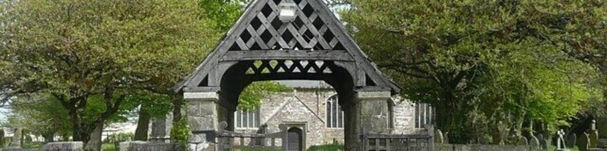 The lych gate, St James's Church, Kilkhampton These covered gateways were built as a sheltered place in which to rest a coffin until the time came to take it into the church. There is a stone in the centre of the gateway on which the coffin was, and I suppose still is, placed.