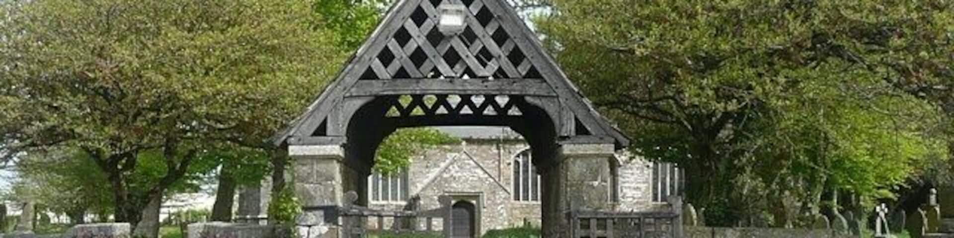 The lych gate, St James's Church, Kilkhampton These covered gateways were built as a sheltered place in which to rest a coffin until the time came to take it into the church. There is a stone in the centre of the gateway on which the coffin was, and I suppose still is, placed.