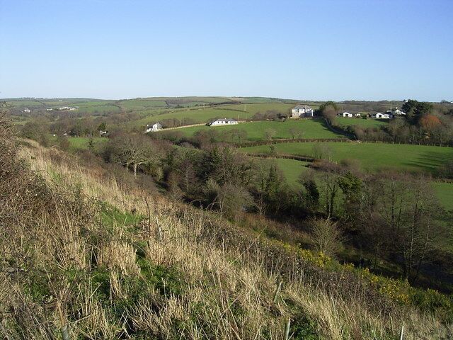 Pinch Hill, Marhamchurch Looking south east towards pinch hill from the Hele Valley Trail. The river Strat lies below in the valley. The Hele Valley trail is 2 footpaths within an area of newly planted woodland, there's also a Geocache nearby.