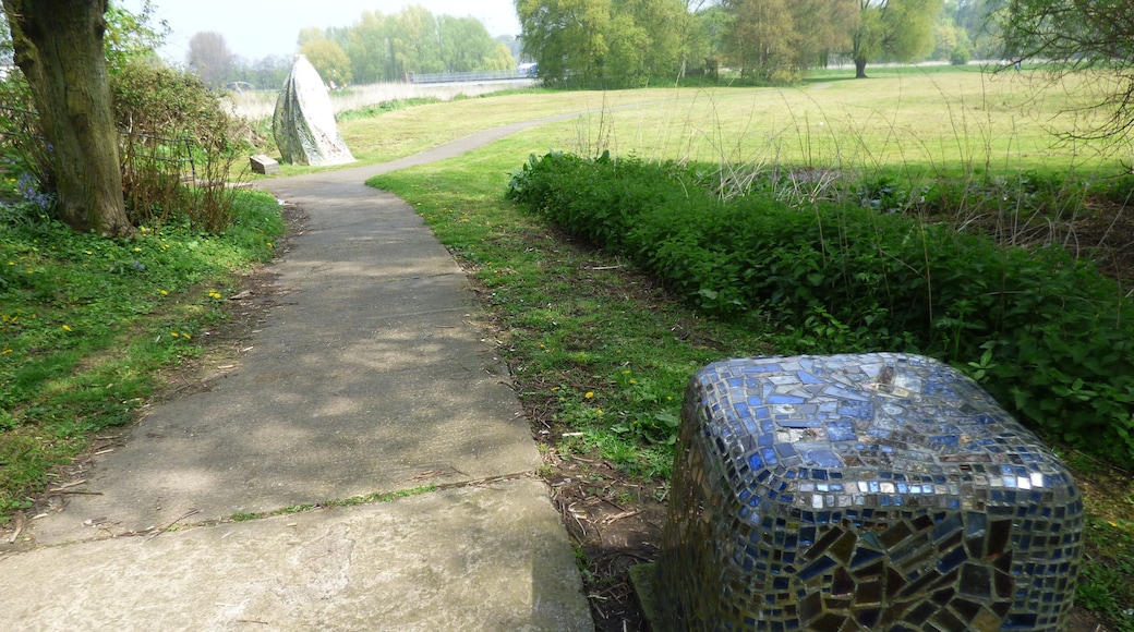 A walk around The Washlands in Burton upon Trent. Around Andressey Island. The River Trent flows past here. Watching the Washlands sculpture, 1993 by Hattie Coppard. Made from Steel, concrete, ceramic tiles, mirror mosaic. The sculptures resemble Indian wayside icons which guard the boundaries of villages from evil. Watching the Washlands It is near the Andressey Bridge.
