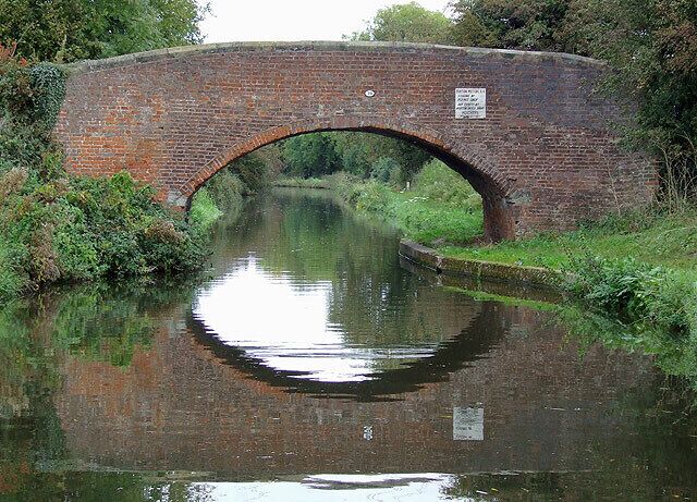 Mill Bridge near Barton-under-Needwood, Staffordshire. Trent and Mersey Canal. The canal was fully opened in 1777. Mill Bridge (No 39) used to carry Mill Lane across the canal to the A38, and across. Since the dual carriageway was constructed, this route has been closed, and people from Barton-under-Needwood are routed to other more elaborate crossings which allow uninterrupted traffic flow on the A38.