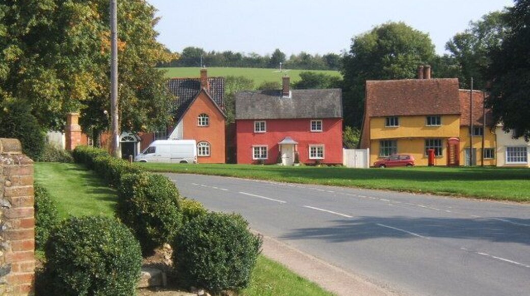 B1066 passing Hartest village green Looking across the front of the village institute from the junction of Somerton Road.