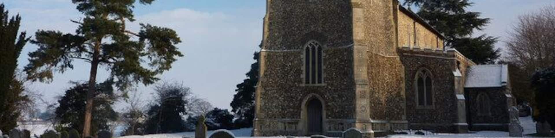 Parish church of St John the Divine, Elmswell, Suffolk, seen from the southwest in snow