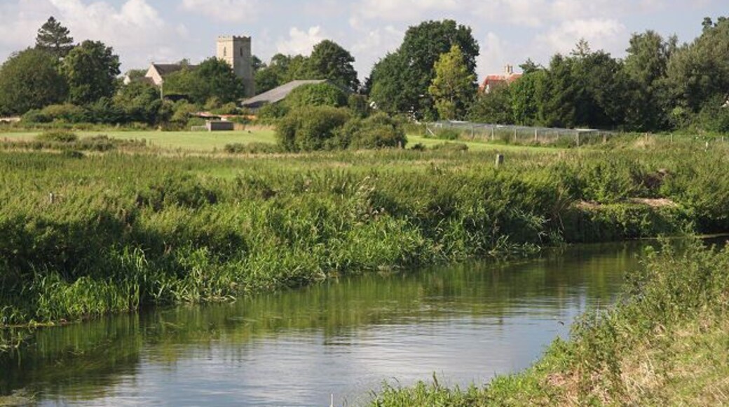 River Lark near Worlington Worlington Church, in an adjacent square, can be seen on the horizon. The River Lark flows from left to right in this photo. A footpath follows the near bank.