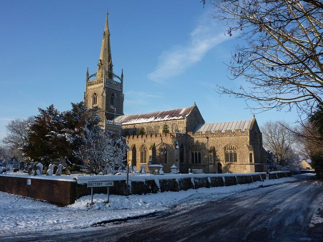 Parish church of the Blesséd Virgin Mary, Woolpit, Suffolk, seen from the southeast from the junction of Rectory Lane, in snow