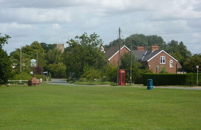 Village green, Hessett A pleasant green with a distant view of the church amongst the trees.