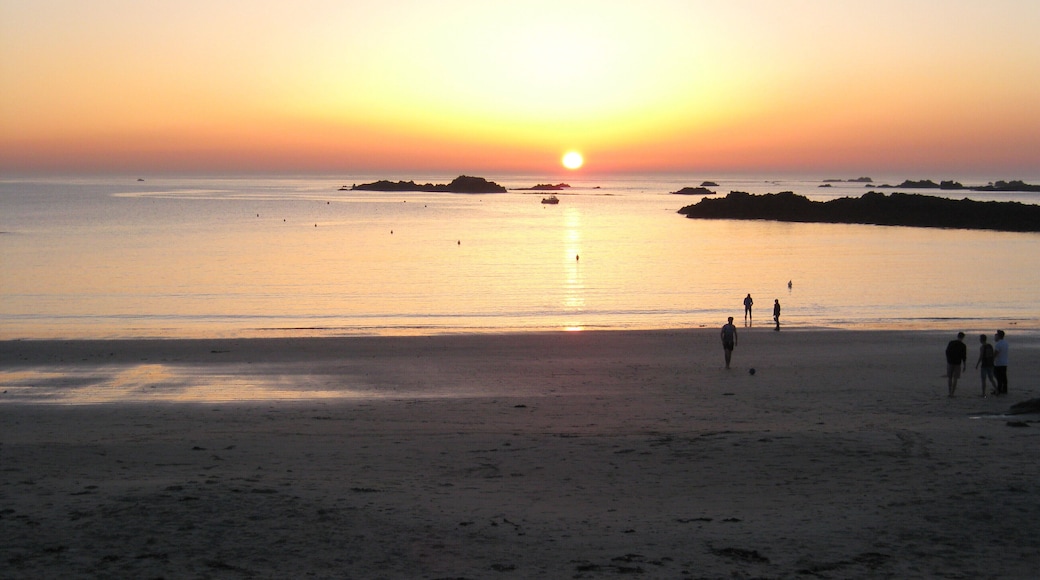 Sunset over Cobo Bay.