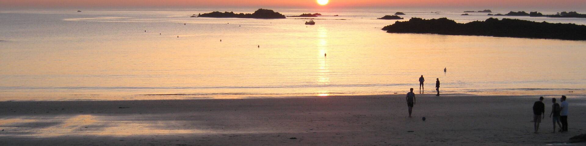 Sunset over Cobo Bay.