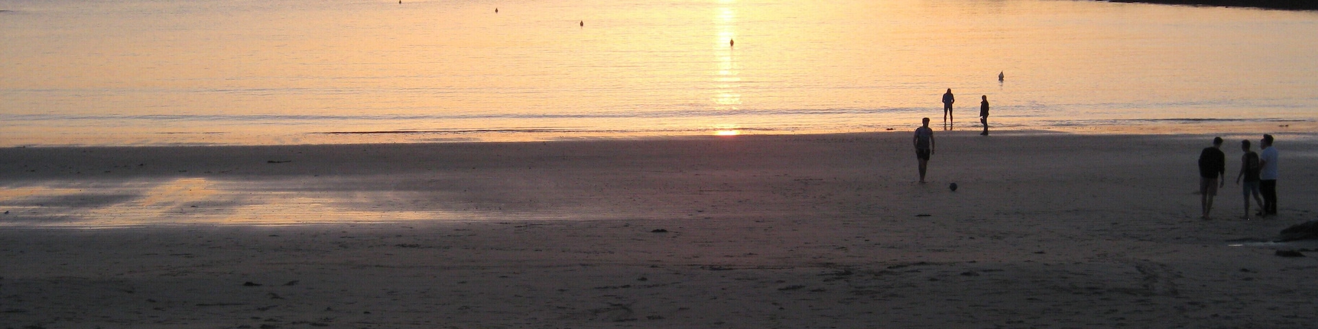 Sunset over Cobo Bay.