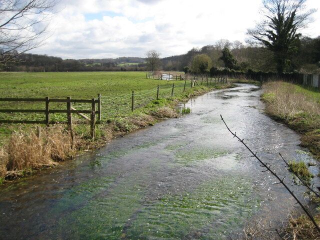 River Chess at Chenies Bottom Viewed looking downstream from the bridge on the road to Flaunden with water meadows on the left.