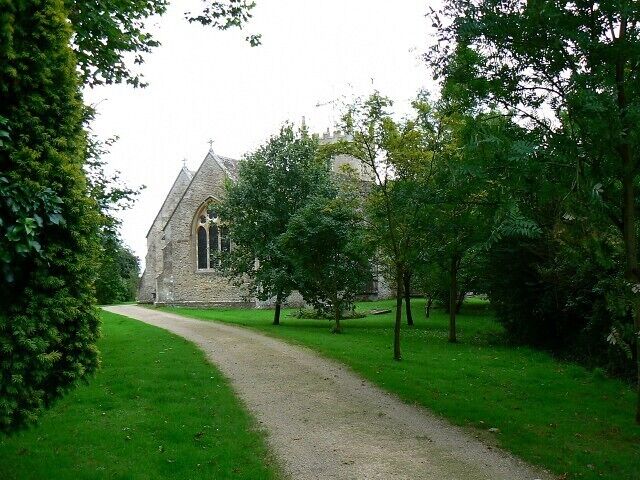 The path to the Church of All Saints, Christian Malford All the path visible is in this square. The church is one of those that sit across a gridline. In this image the eastern end of the church just to the right of the path is in this square. The tower in the background is in ST9578. The viewpoint is just under 40 metres from the western gridline.