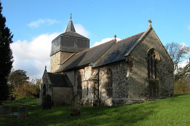 Parish church of St Mary the Virgin, Brushford, Devon, seen from the southeast. The bell stage of the west tower is timber framed and hung with slate.