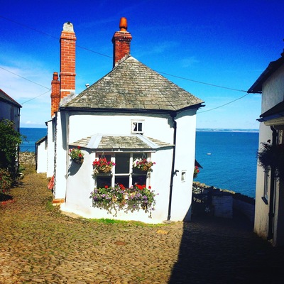 Clovelly in Devon UK. One of the most picturesque places on the planet! No cars allowed, residents must park at the top if the village & pull everything up on a sledge!