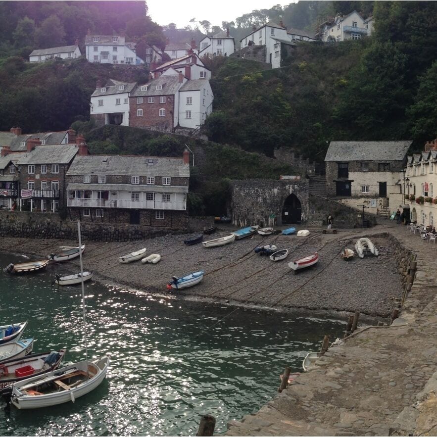 Clovelly set into a steep hillside, is one of the most famous villages in the world.
Clovelly has a single cobbled high street winds its way down the hillside to the ancient Clovelly harbour, through traditional whitewashed cottages festooned with fuchsias and geraniums - the street dropping 400ft (half a mile) as it winds its way through Clovelly's 16th century cottages to the harbour.
Traffic is banned from the high street, visitors parking at the top of the hill adjacent to Clovelly Heritage Centre. For a small fee, a landrover service ferries visitors up and down the steep hill via a back road, to the harbourside Red Lion Public House.
The street of Clovelly are too steep for motor vehicles, hence why for centuries, donkeys were used for getting up and down the street. Donkeys still live at the the top of the hill where children can have a donkey ride in the summer.
